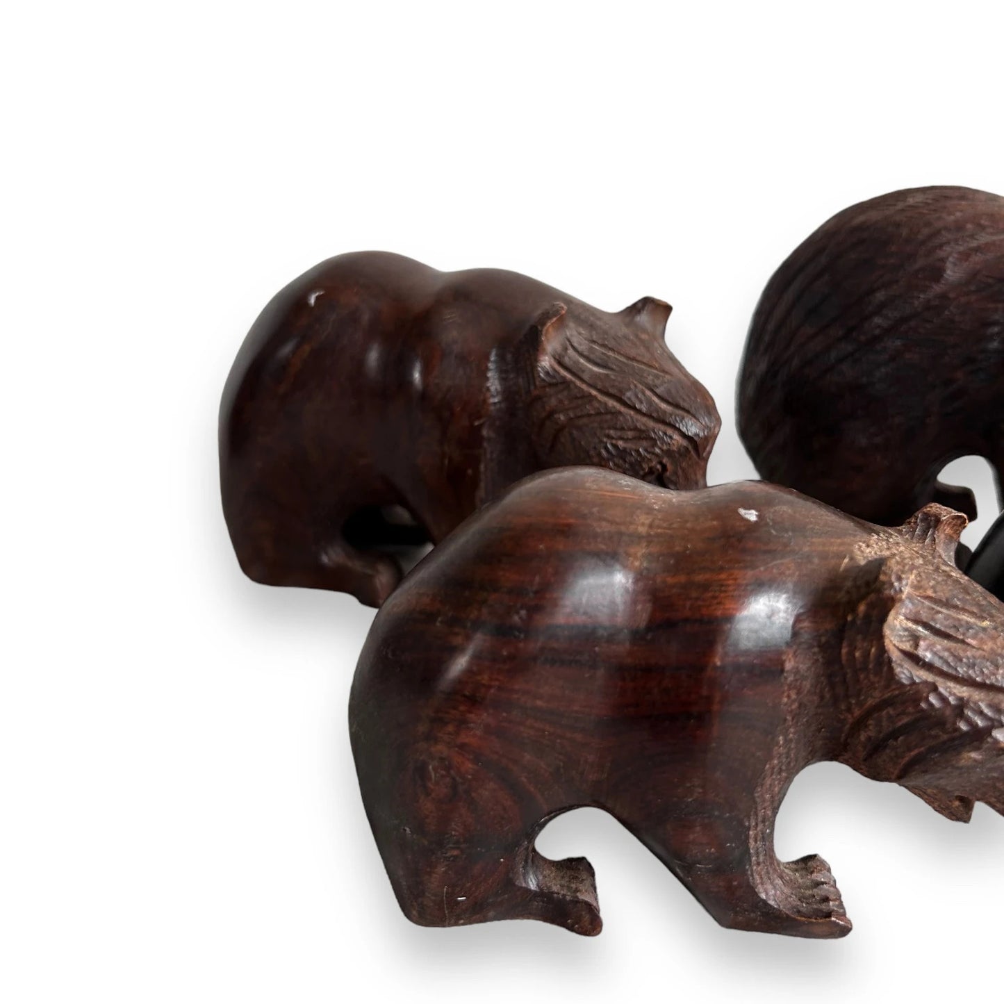 Mid century set of four dark wood bear statues