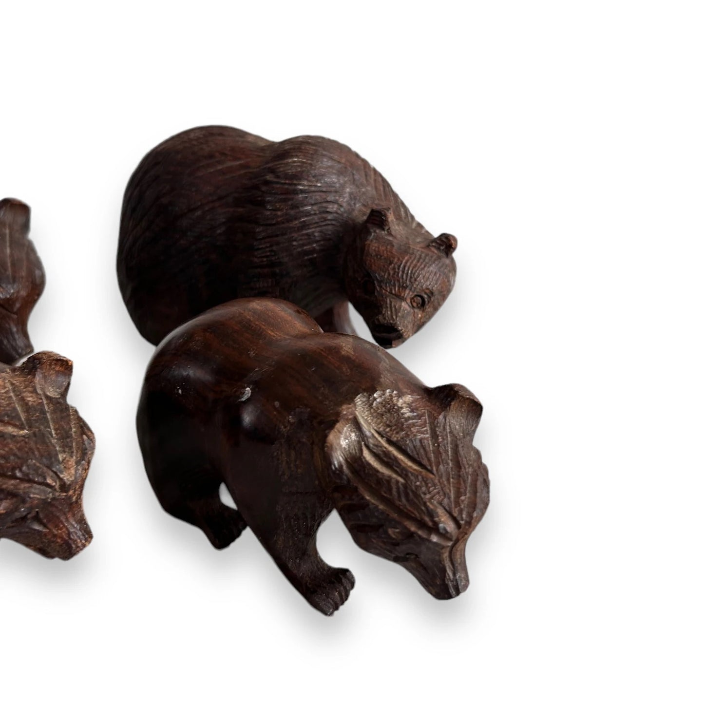 Mid century set of four dark wood bear statues