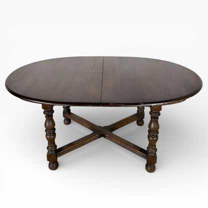 Ercol Dark Elm Oval Extending Dining Table