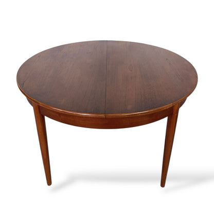Mid Century Elliotts of Newbury Extending Teak Dining Table Round to Oval Butterfly Leaf Table