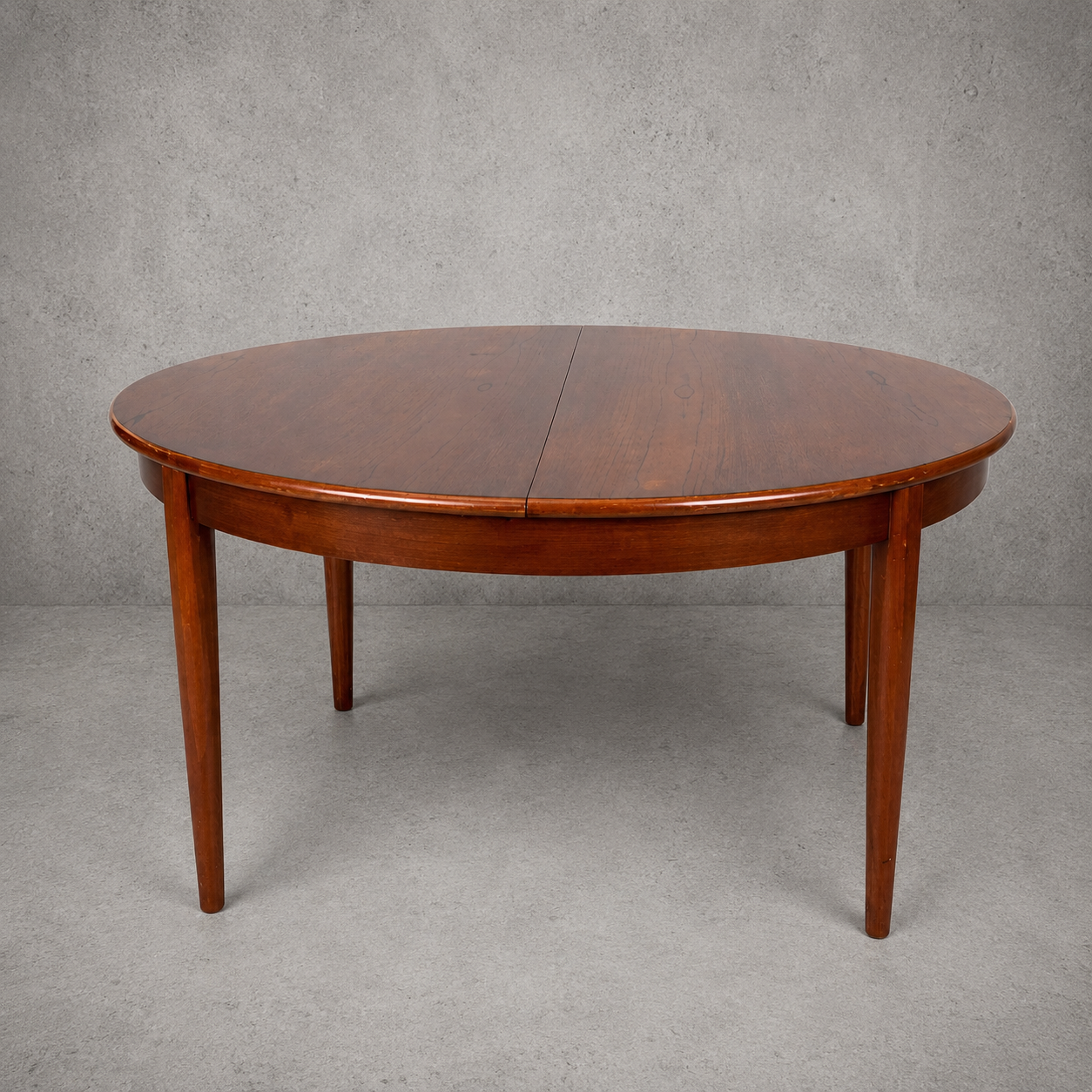 Mid Century Elliotts of Newbury Extending Teak Dining Table Round to Oval Butterfly Leaf Table