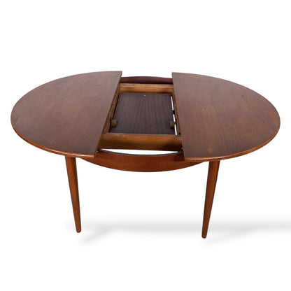 Mid Century Elliotts of Newbury Extending Teak Dining Table Round to Oval Butterfly Leaf Table