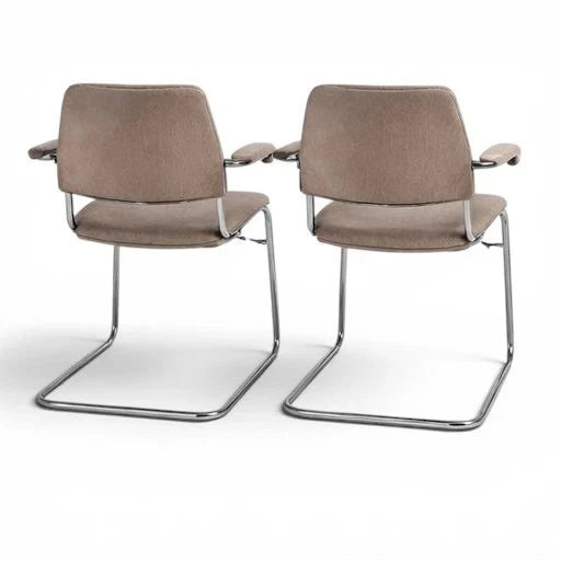 Chrome cantilever frame detail on vintage armchairs