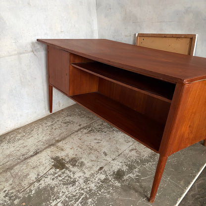 Rear storage shelves and lockable cupboard on mid-century teak desk