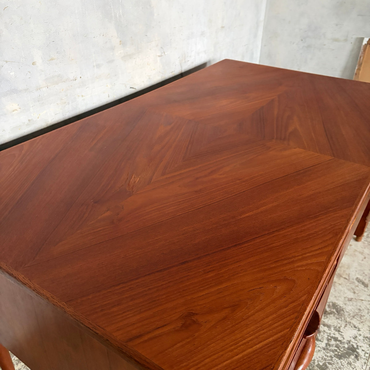 Close detail of the refinished patterned teak desktop