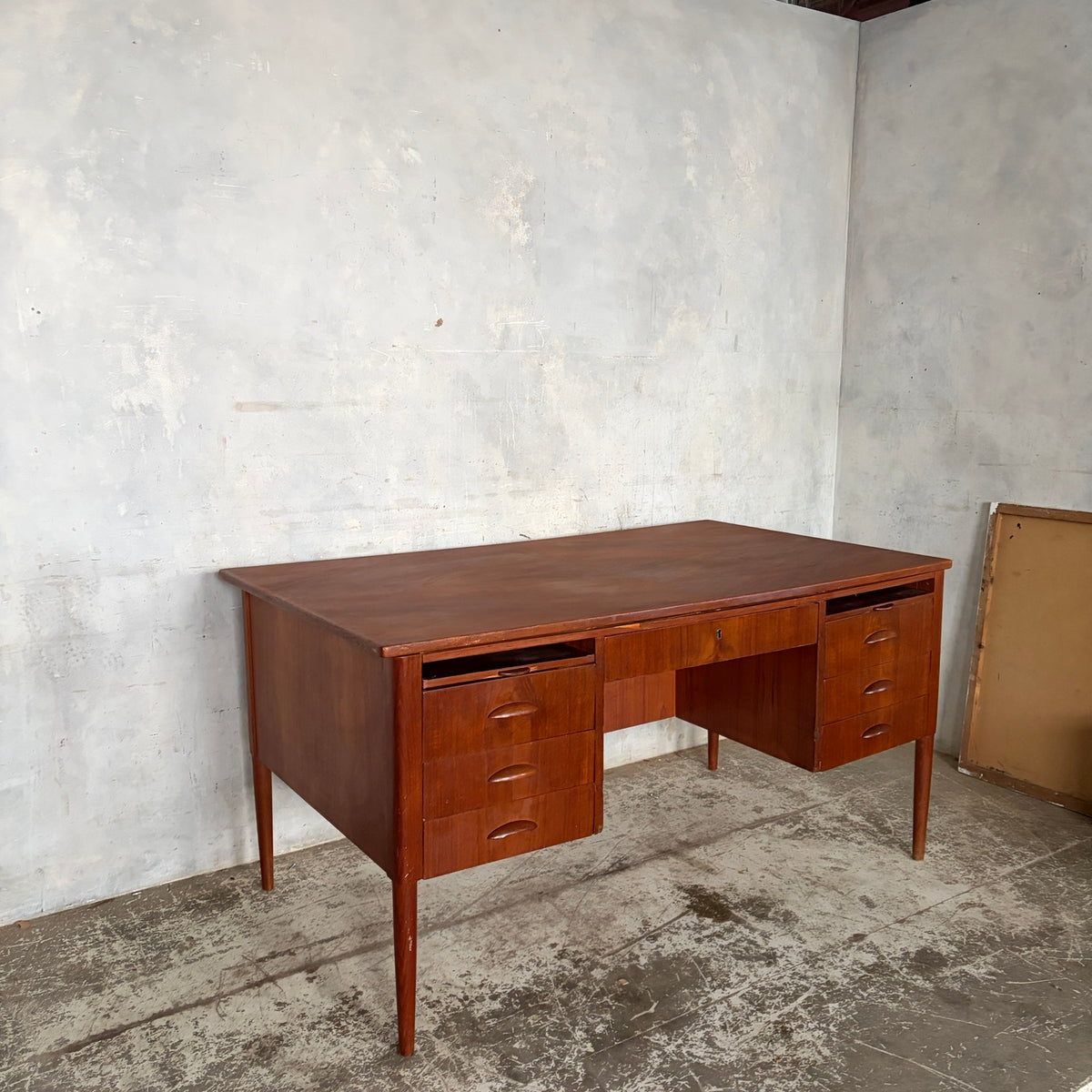 Large 1960s teak writing desk viewed from the side