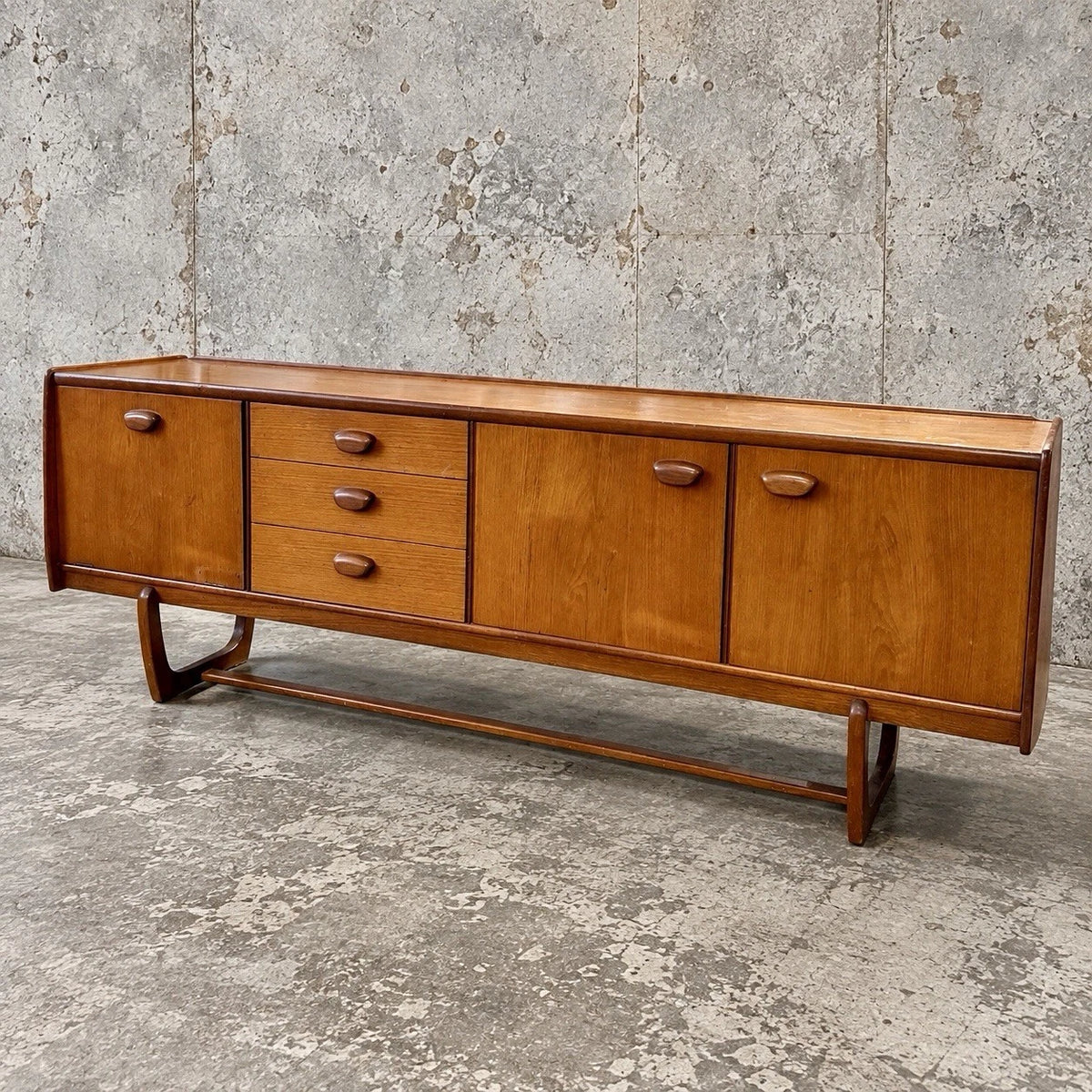 Mid Century Portwood Teak Long Sideboard with Sculptural Sleigh Legs - view 1