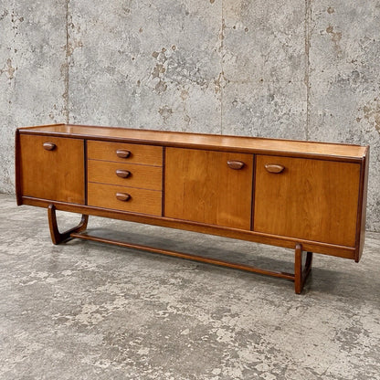 Mid Century Portwood Teak Long Sideboard with Sculptural Sleigh Legs - view 1
