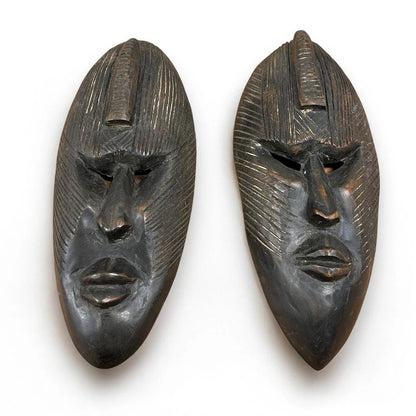 Vintage 1960s pair of African carved wood masks