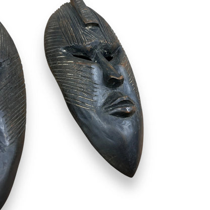 Vintage 1960s pair of African carved wood masks