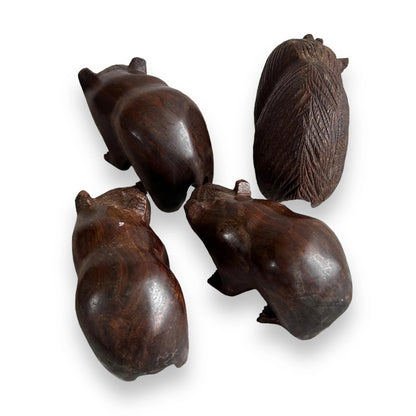 Mid century set of four dark wood bear statues