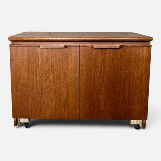 Mid-century teak two-door storage cabinet on castors – photograph 1