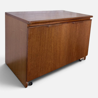 Mid-century teak two-door storage cabinet on castors – photograph 5