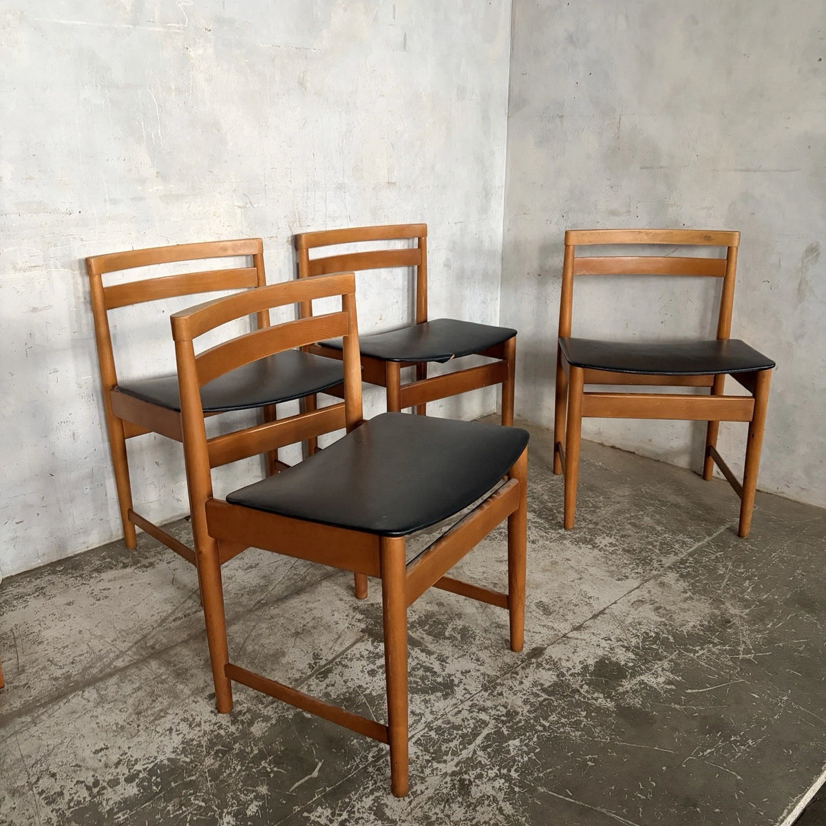 Set of four mid-century teak and beech dining chairs with black vinyl seats – view 2