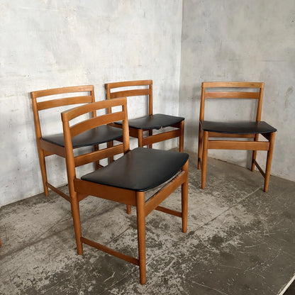 Set of four mid-century teak and beech dining chairs with black vinyl seats – view 2