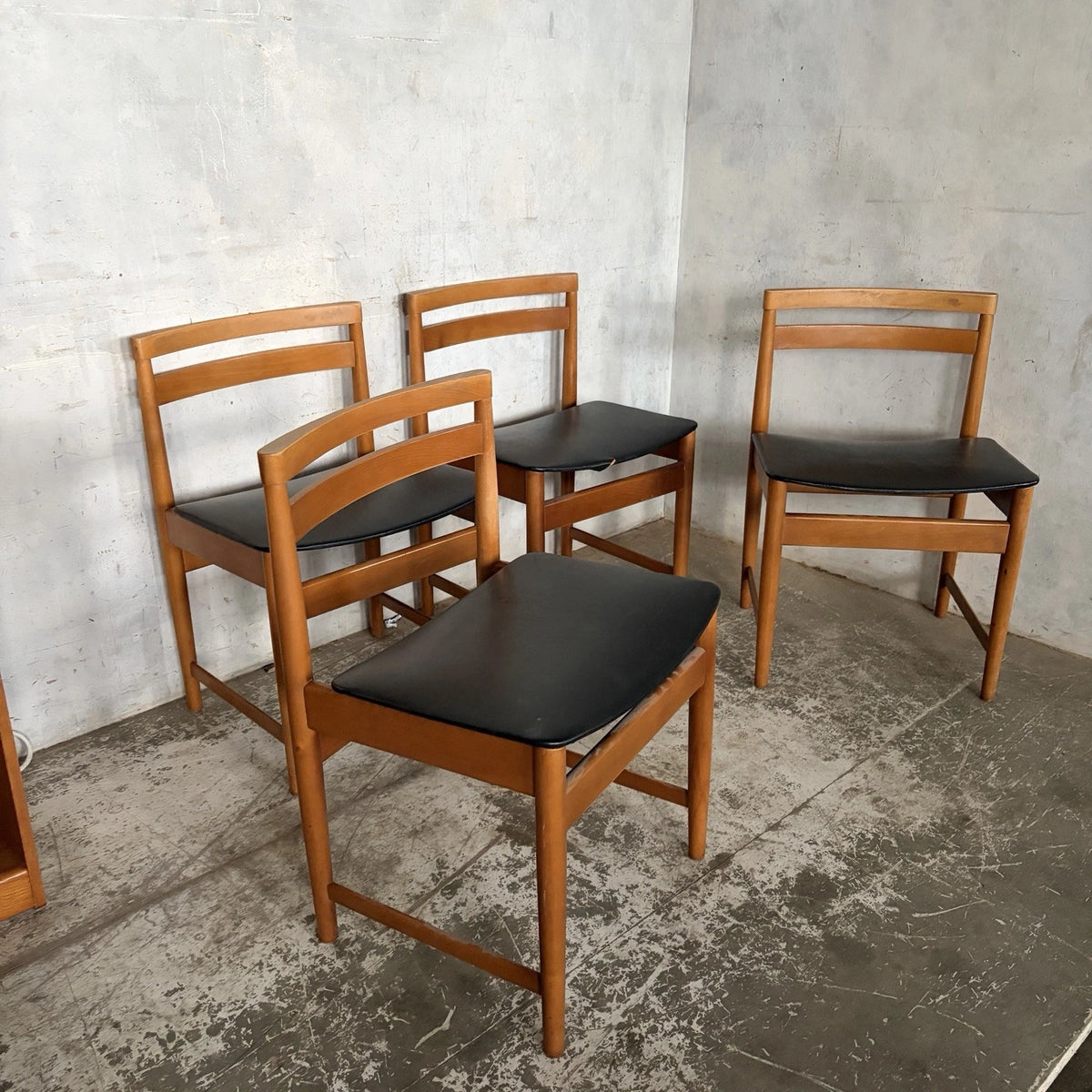 Set of four mid-century teak and beech dining chairs with black vinyl seats – view 3