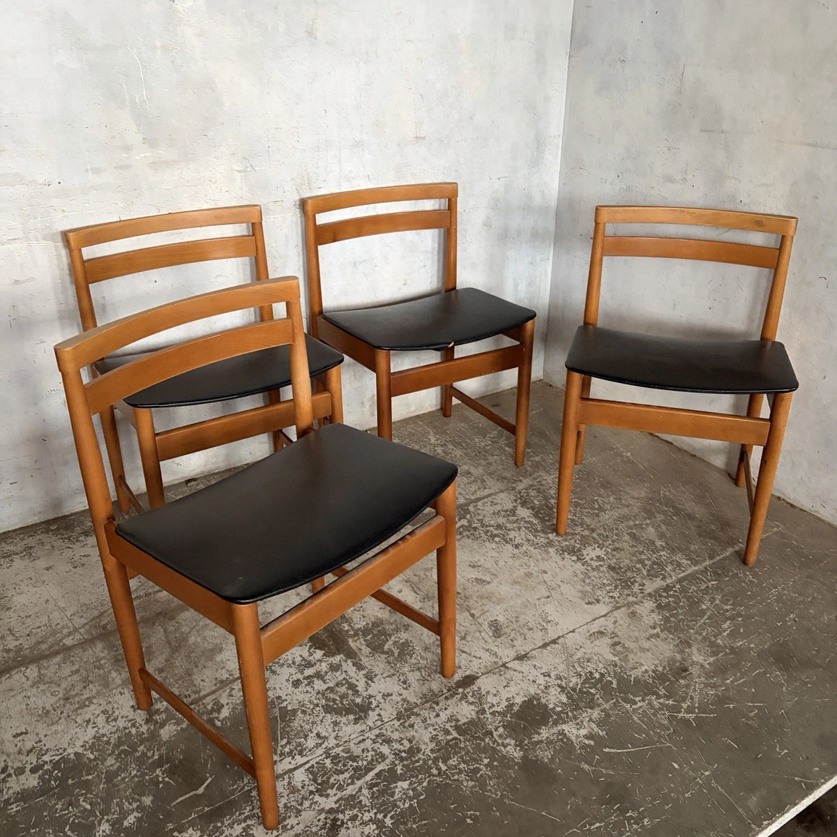 Set of four mid-century teak and beech dining chairs with black vinyl seats – view 4