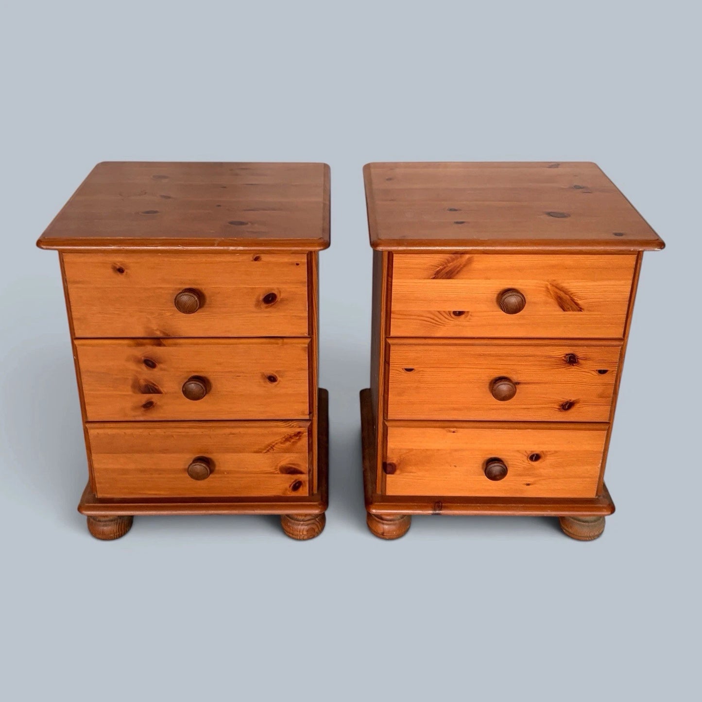 Pair of traditional pine three-drawer bedside cabinets - view 1