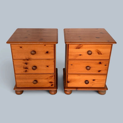 Pair of traditional pine three-drawer bedside cabinets - view 1